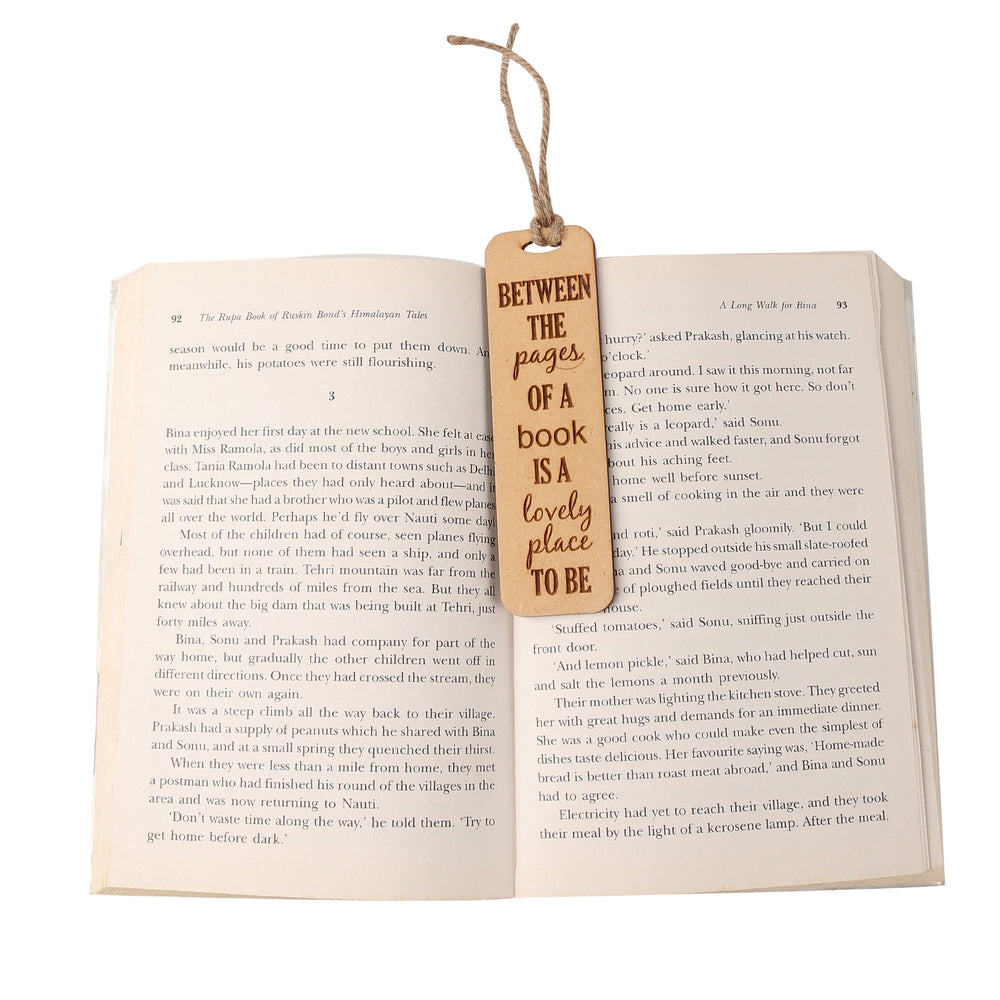 Between the pages of a book is a lovely place to be - Wooden Bookmark - The Engraved Store