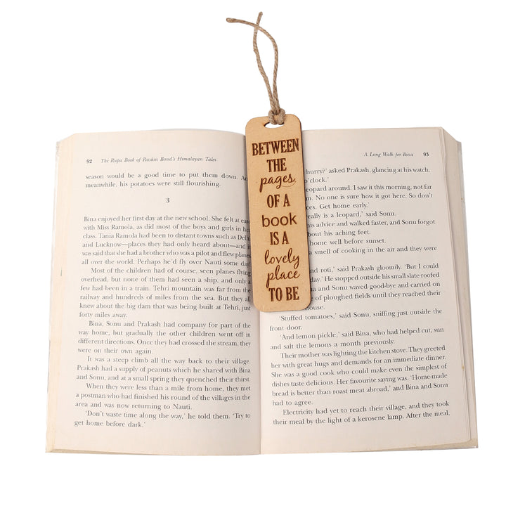Between the pages of a book is a lovely place to be - Wooden Bookmark - The Engraved Store